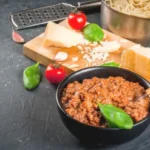 "A bowl of rich bolognese sauce recipe with pasta"