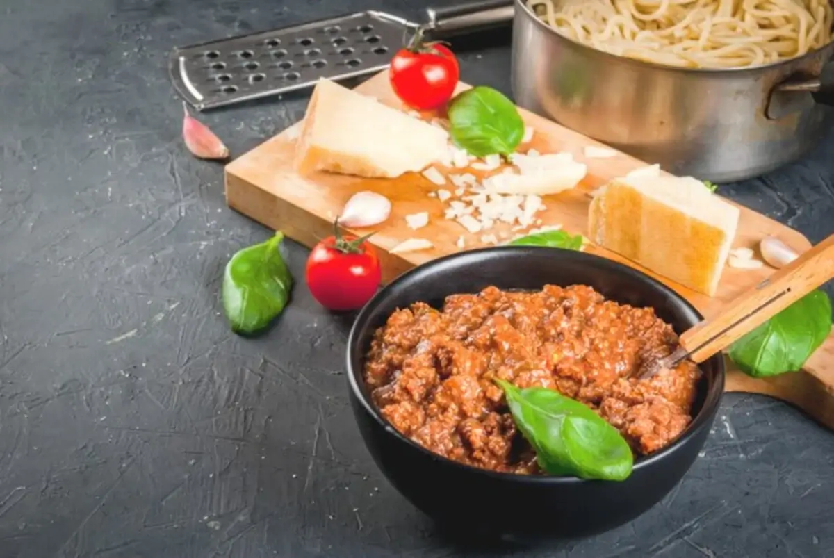 "A bowl of rich bolognese sauce recipe with pasta"
