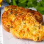 "Freshly baked cheesy garlic bread with melted cheese and herbs"