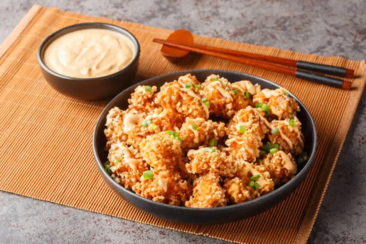 "A plate of Crispy Bang Bang Chicken with a golden, crunchy coating"