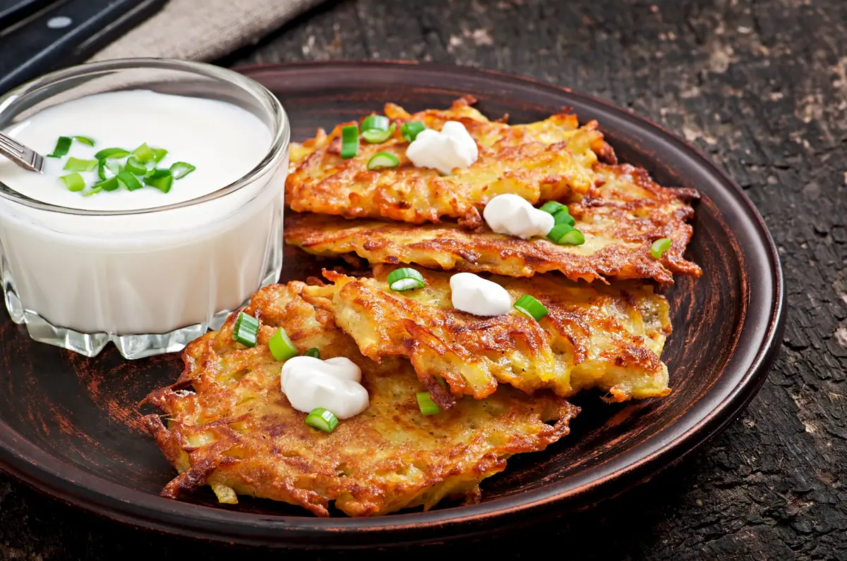 "Crispy German Potato Pancakes with applesauce on the side"